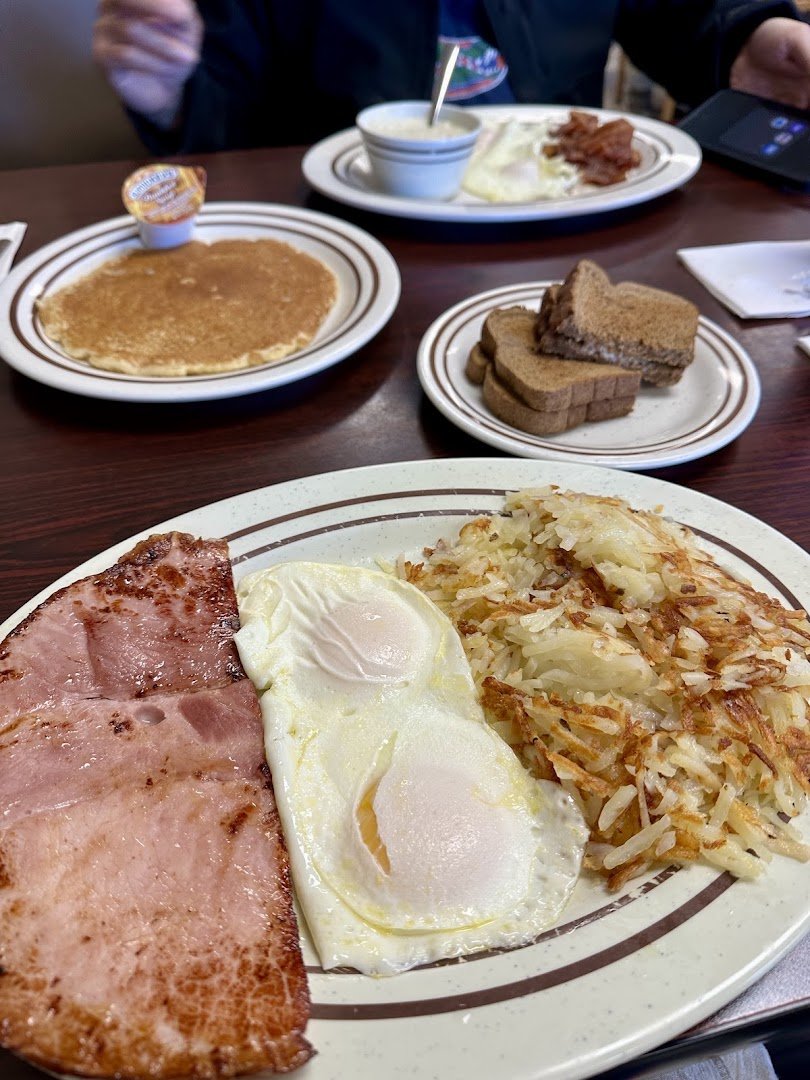 Breakfast plates on a diner table.